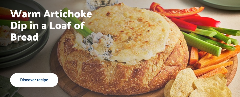 Warm Artichoke Dip in a Loaf of Bread.